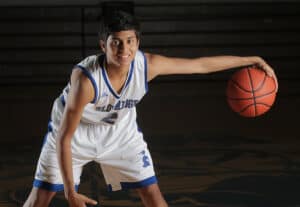 student playing basketball