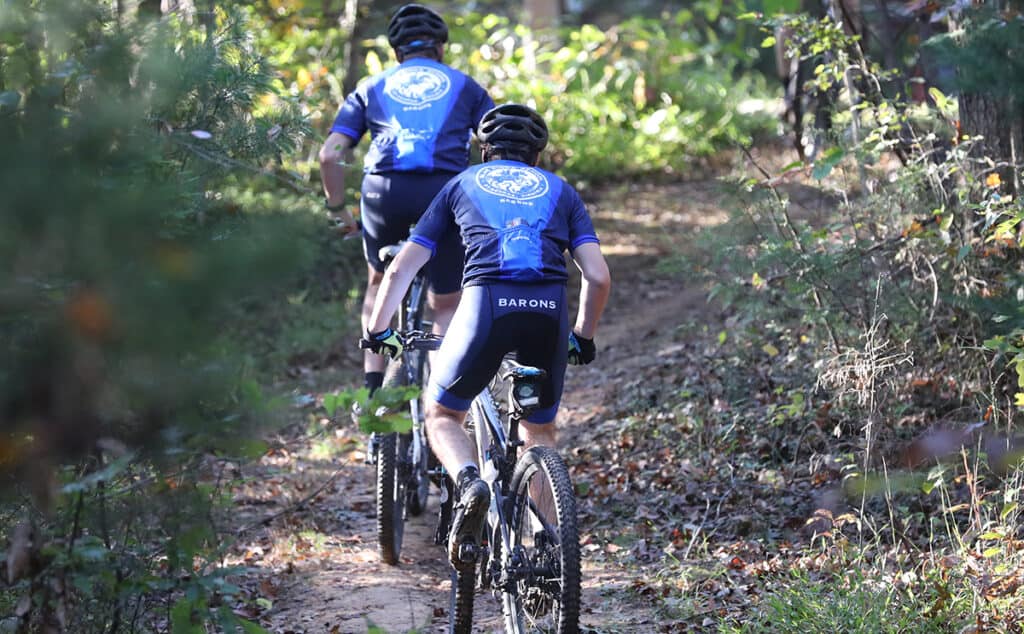 mountain biking up a trail