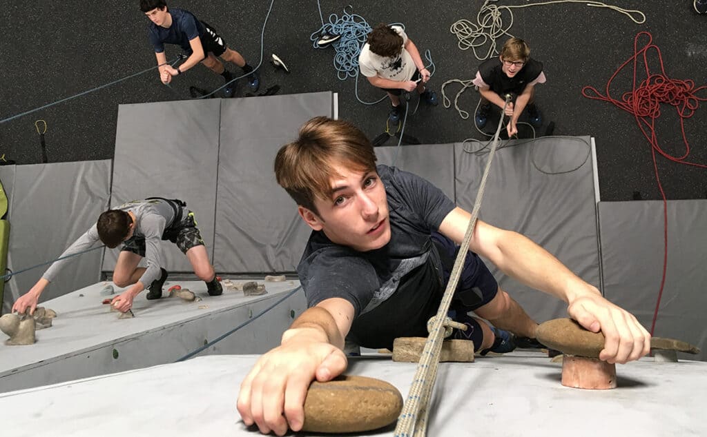 students on the indoor climbing wall