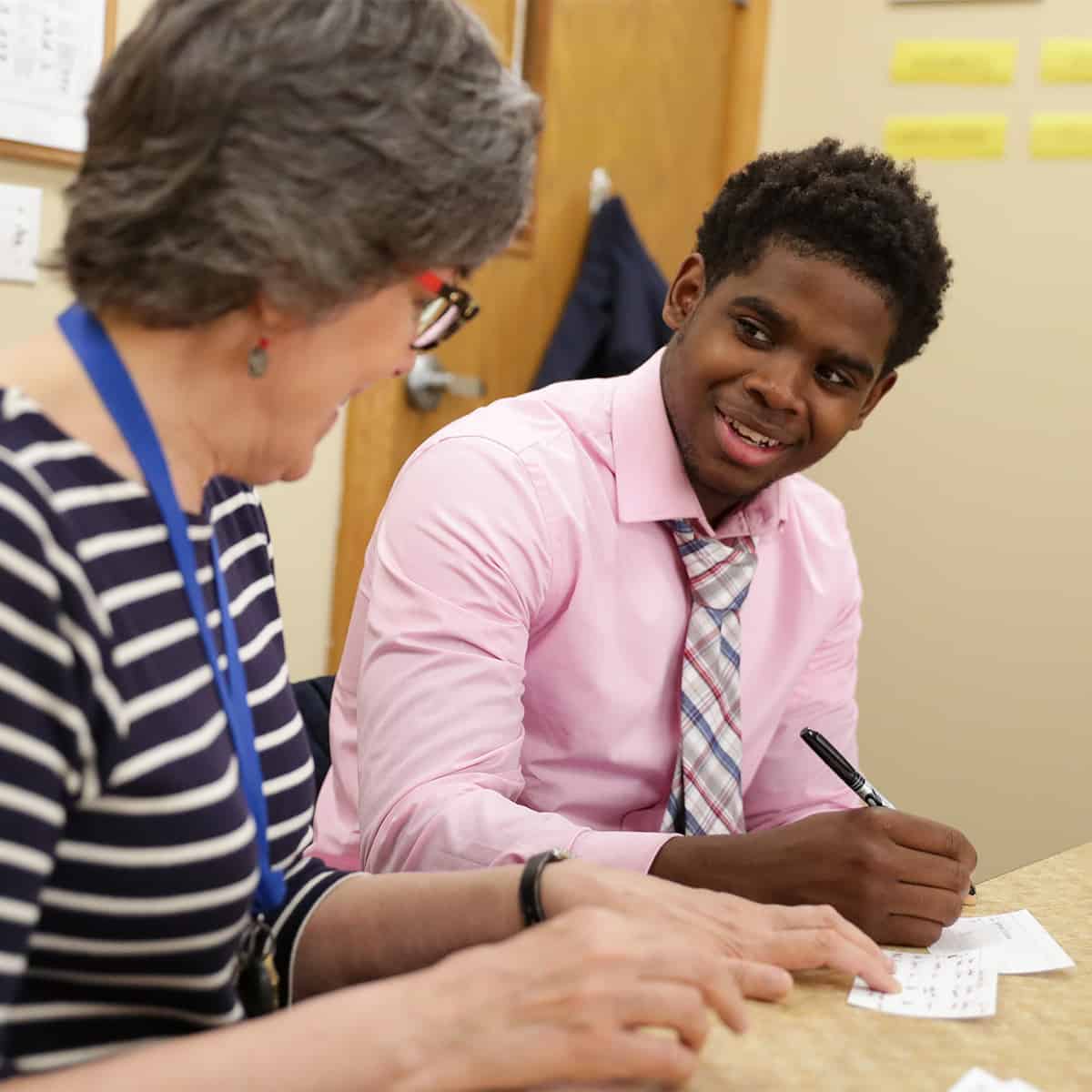 Student working with a learning specialist