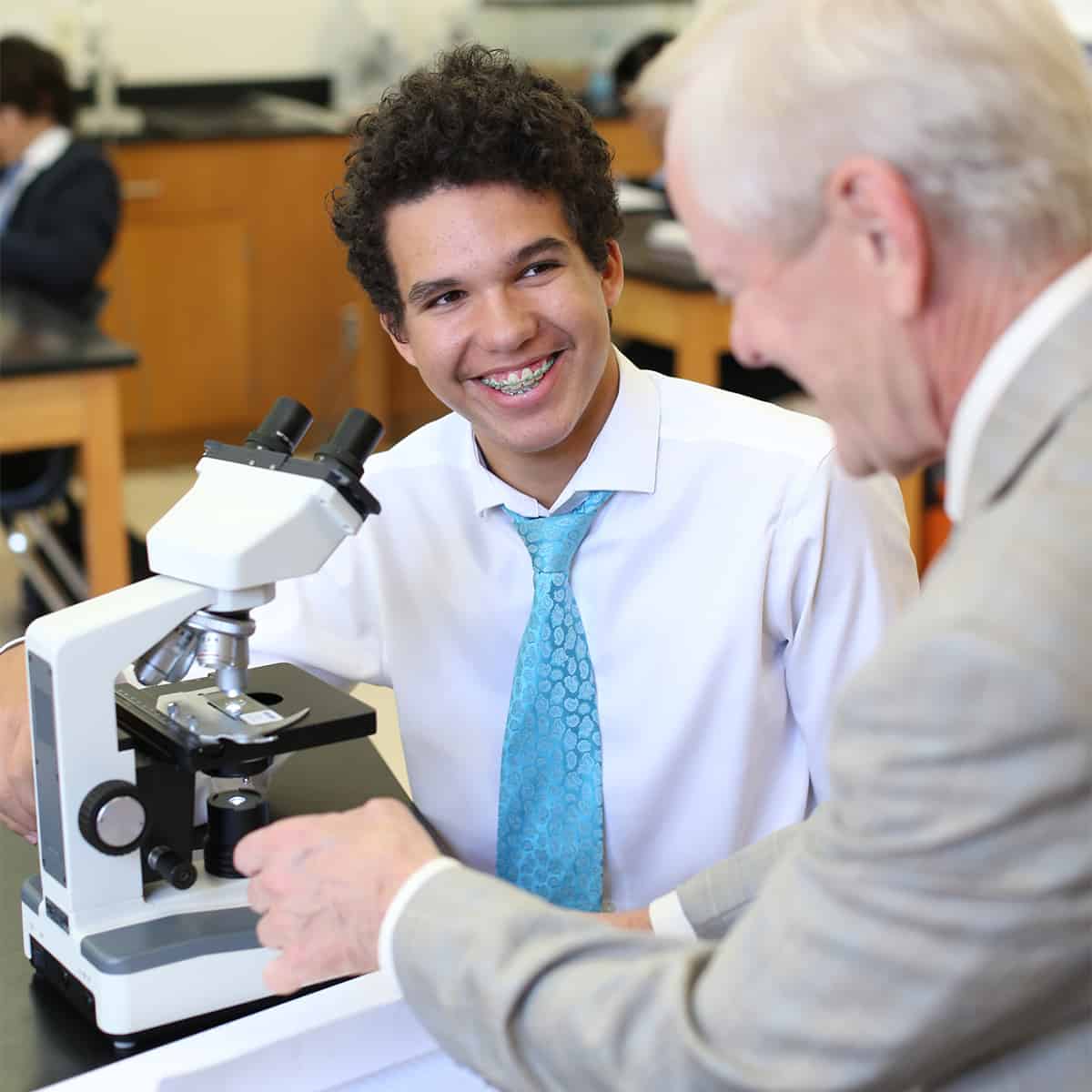 student and teacher in science class