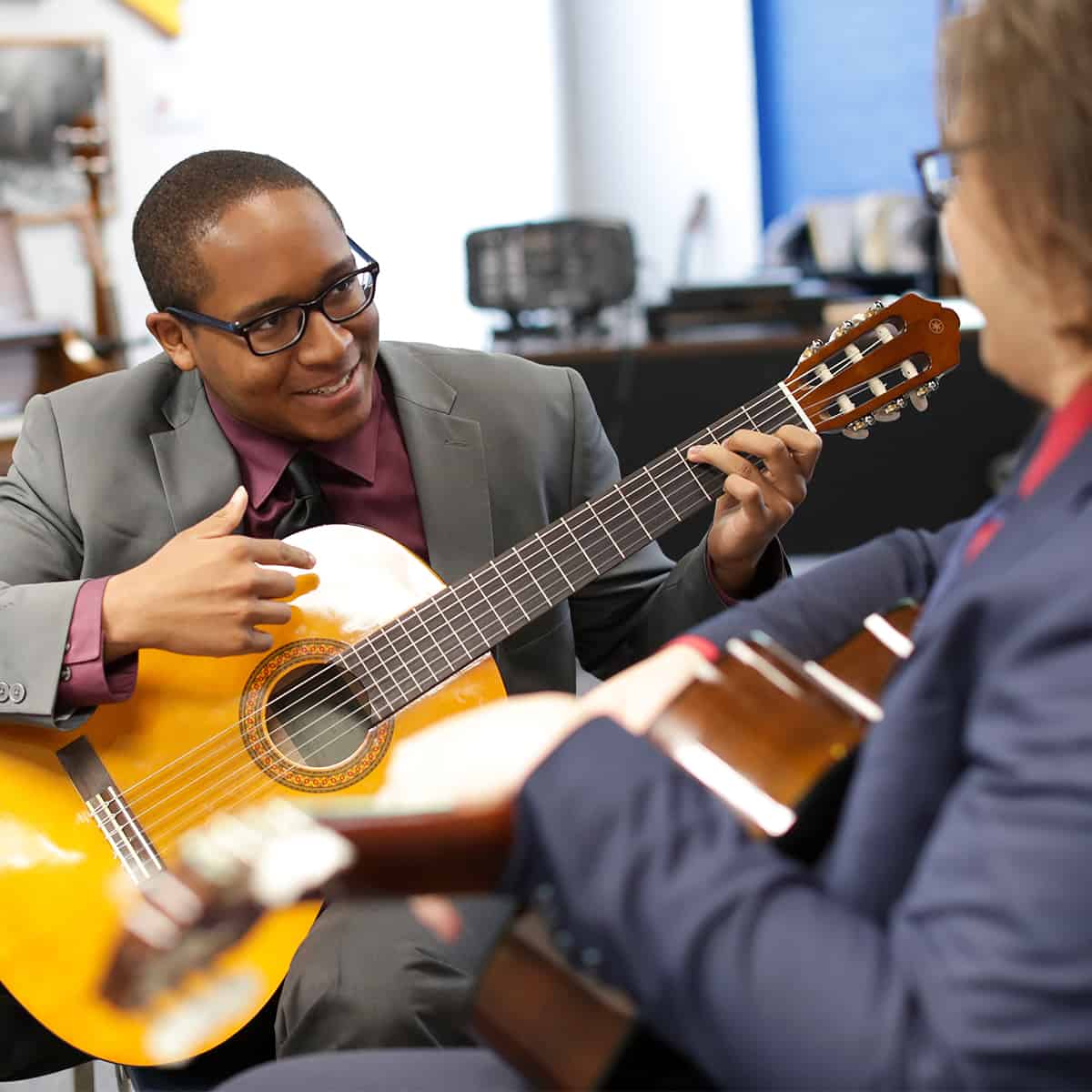 Students playing guitar.